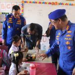 Ditpolairud Polda Sumut Gelar Bakti Sosial Makan Bergizi Gratis untuk Siswa SD di Kampung Nelayan Seberang