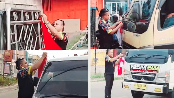 LSM GMBI Lebak membagikan bendera merah putih kepada pengendara menjelang HUT RI ke-80