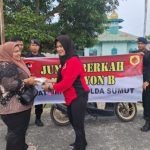 Brimob Polda Sumut dan Bhayangkari membagikan makan siang gratis di Tanjung Balai