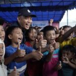 PalmCo Pulihkan Trauma Warga Pascabanjir